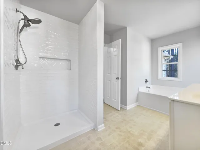 a bathroom with a bath tub