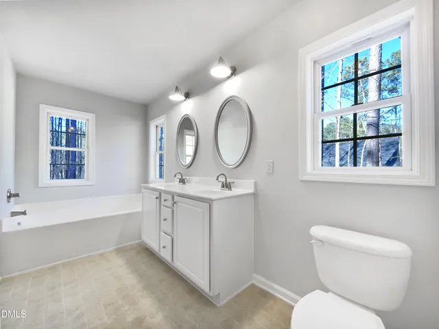 a bathroom with a toilet a sink and a bathtub