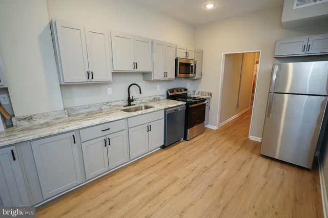 a view of outdoor space with wooden floor and windows