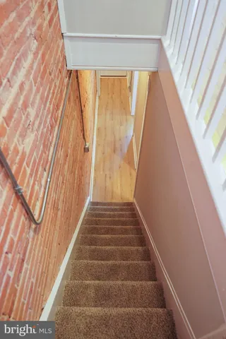 a view of a wooden door and an entrance