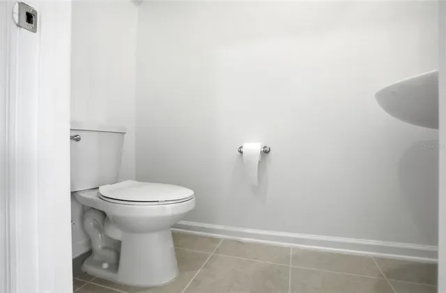 a bathroom with a toilet and a sink
