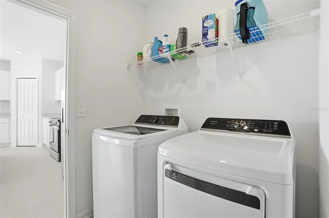a utility room with dryer and washer