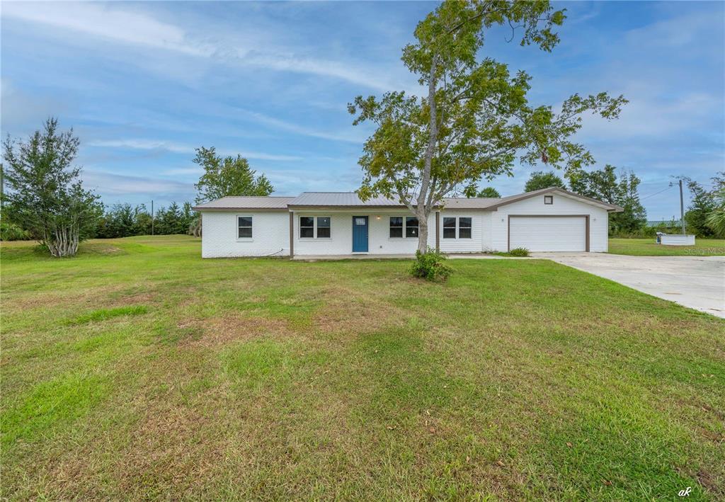 5338 Frank Hough Road Panama City, FL 32404 - Photo 1 of 29 front view of a house with a big yard