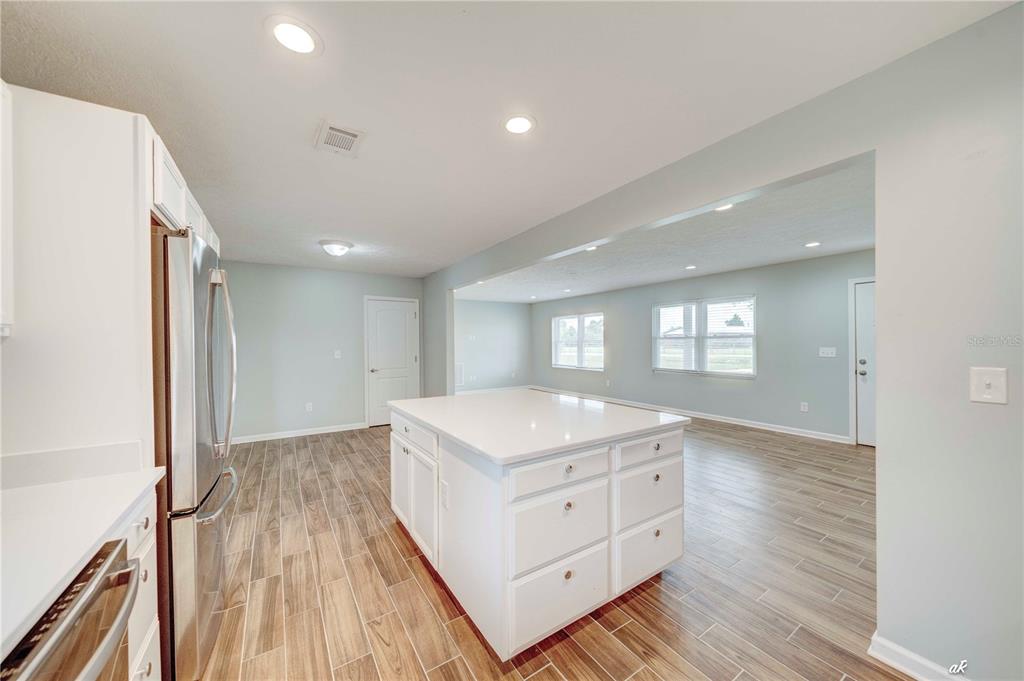 5338 Frank Hough Road Panama City, FL 32404 - Photo 11 of 29 a kitchen with a hard wood floor