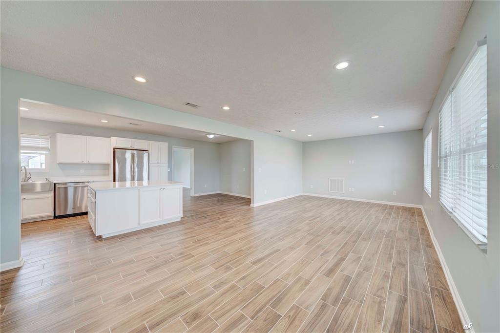 5338 Frank Hough Road Panama City, FL 32404 - Photo 14 of 29 a view of empty room with wooden floor and window