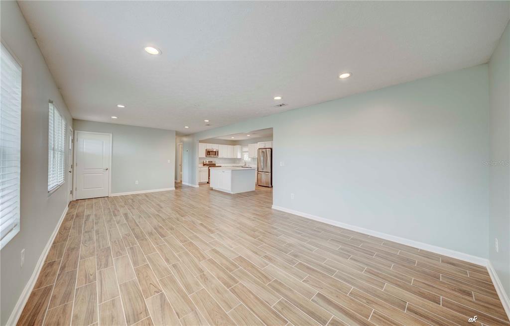 5338 Frank Hough Road Panama City, FL 32404 - Photo 15 of 29 a view of empty room with wooden floor
