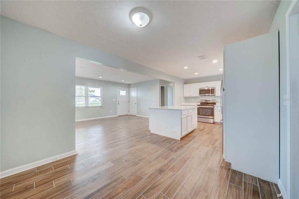 5338 Frank Hough Road Panama City, FL 32404 - Photo 19 of 29 a view of kitchen and wooden floor