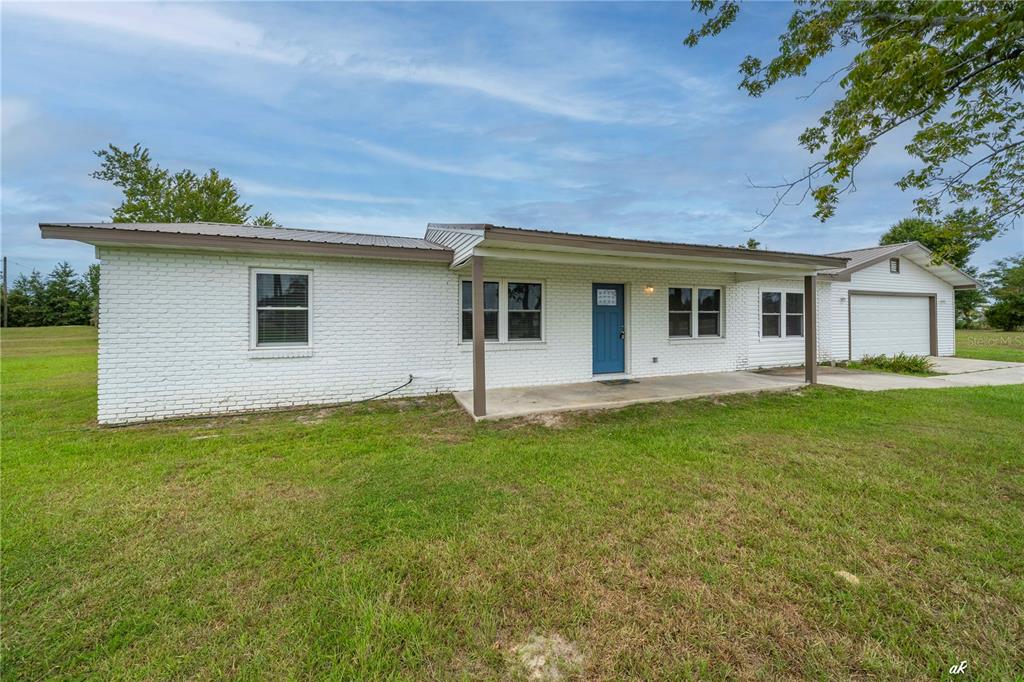 5338 Frank Hough Road Panama City, FL 32404 - Photo 2 of 29 a backyard of a house with seating space
