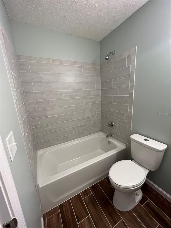 5338 Frank Hough Road Panama City, FL 32404 - Photo 28 of 29 a bathroom with a toilet a sink and bathtub