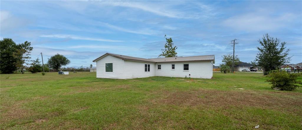 5338 Frank Hough Road Panama City, FL 32404 - Photo 5 of 29 a house view with a garden space