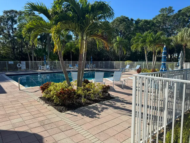 a view of a backyard with sitting area