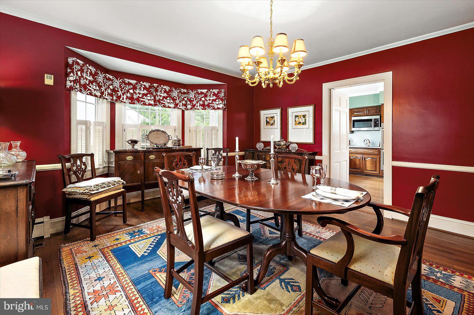 921 Riverside Drive Salisbury, MD 21801 - Photo 16 of 62 a view of a dining room with furniture a chandelier and wooden floor