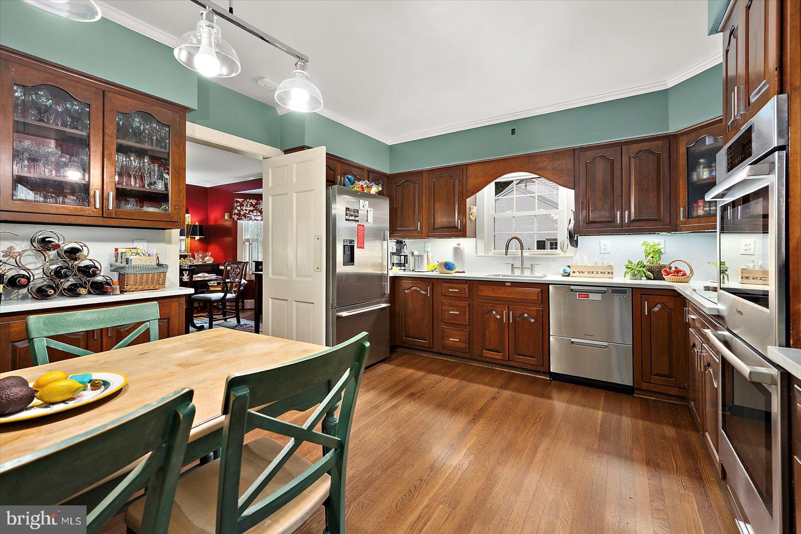 921 Riverside Drive Salisbury, MD 21801 - Photo 17 of 62 a kitchen with stainless steel appliances granite countertop a stove a sink dishwasher and a refrigerator with cabinets
