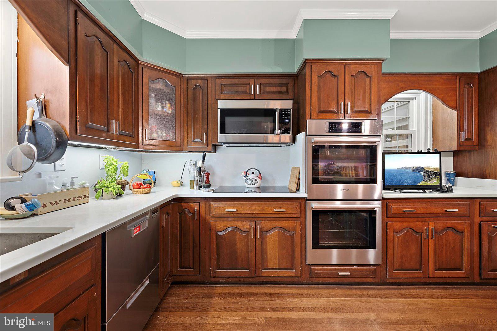 921 Riverside Drive Salisbury, MD 21801 - Photo 20 of 62 a kitchen with stainless steel appliances granite countertop a sink stove and microwave