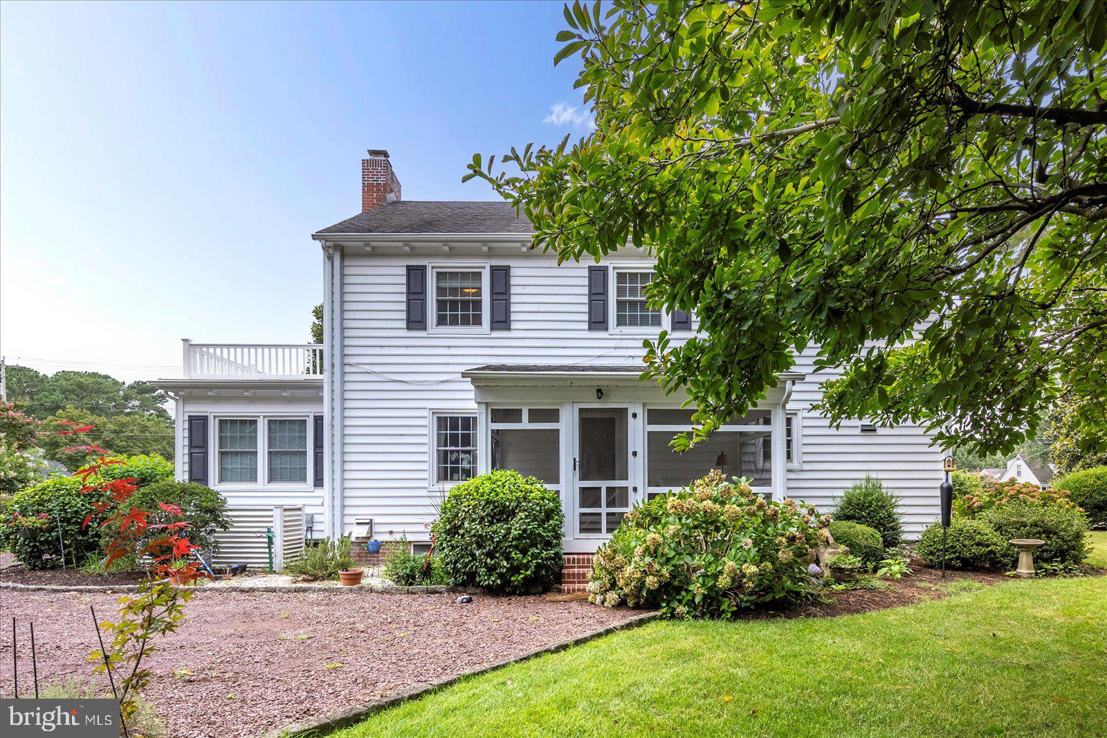 921 Riverside Drive Salisbury, MD 21801 - Photo 3 of 62 a front view of a house with a garden and plants