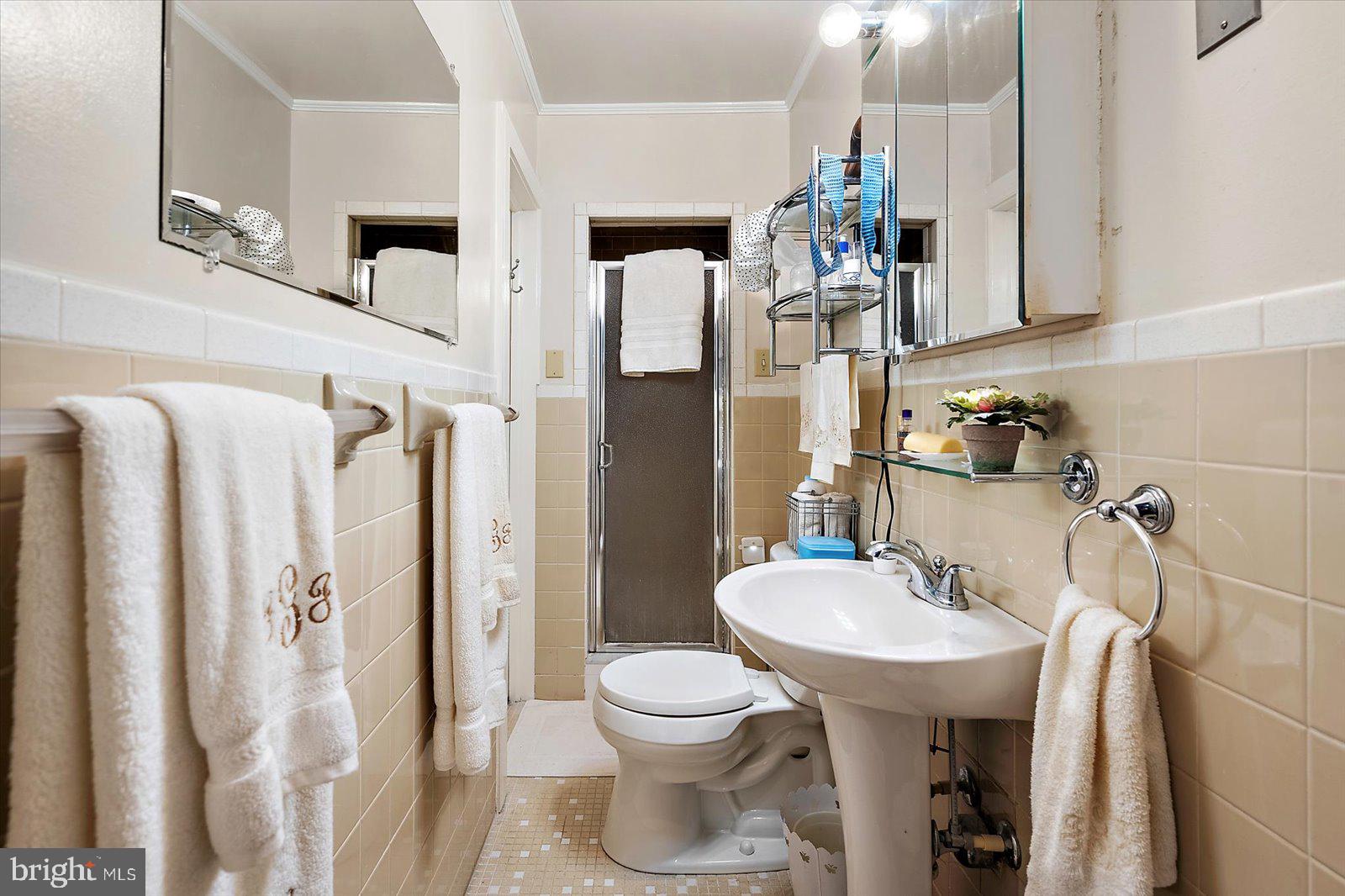 921 Riverside Drive Salisbury, MD 21801 - Photo 34 of 62 a bathroom with a sink toilet and shower