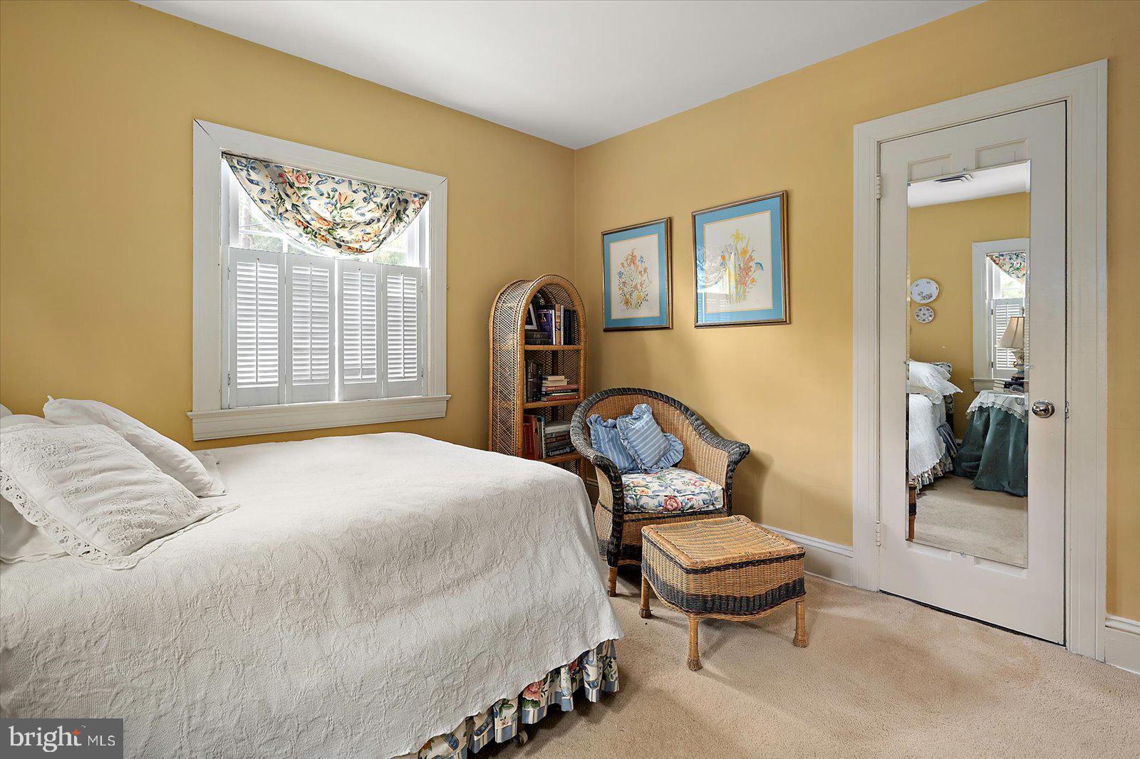 921 Riverside Drive Salisbury, MD 21801 - Photo 36 of 62 a bedroom with a bed and a painting on the wall