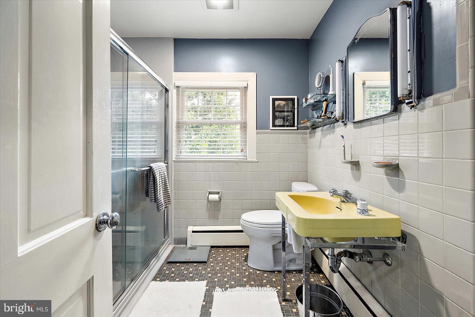 921 Riverside Drive Salisbury, MD 21801 - Photo 38 of 62 a bathroom with a toilet a sink and mirror
