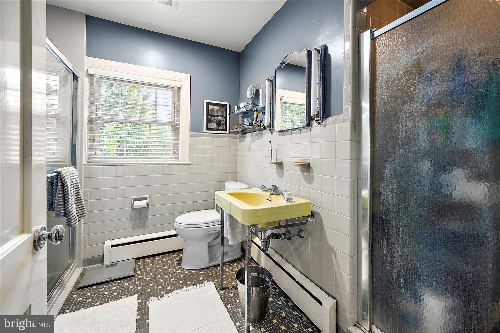 921 Riverside Drive Salisbury, MD 21801 - Photo 39 of 62 a bathroom with a sink toilet and shower