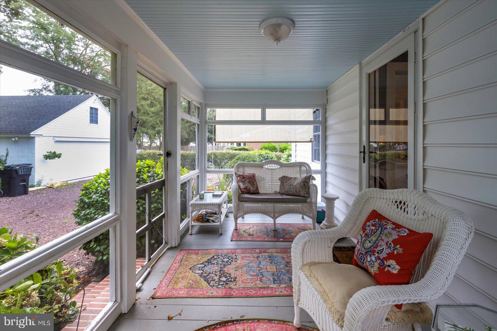 921 Riverside Drive Salisbury, MD 21801 - Photo 46 of 62 a living room with furniture and a floor to ceiling window