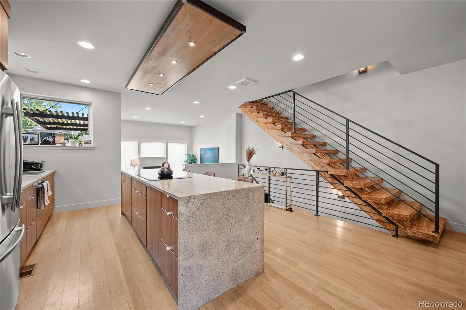 3448 West 36th Avenue Denver, CO 80211 - Photo 12 of 48 a kitchen with counter top space and wooden floor