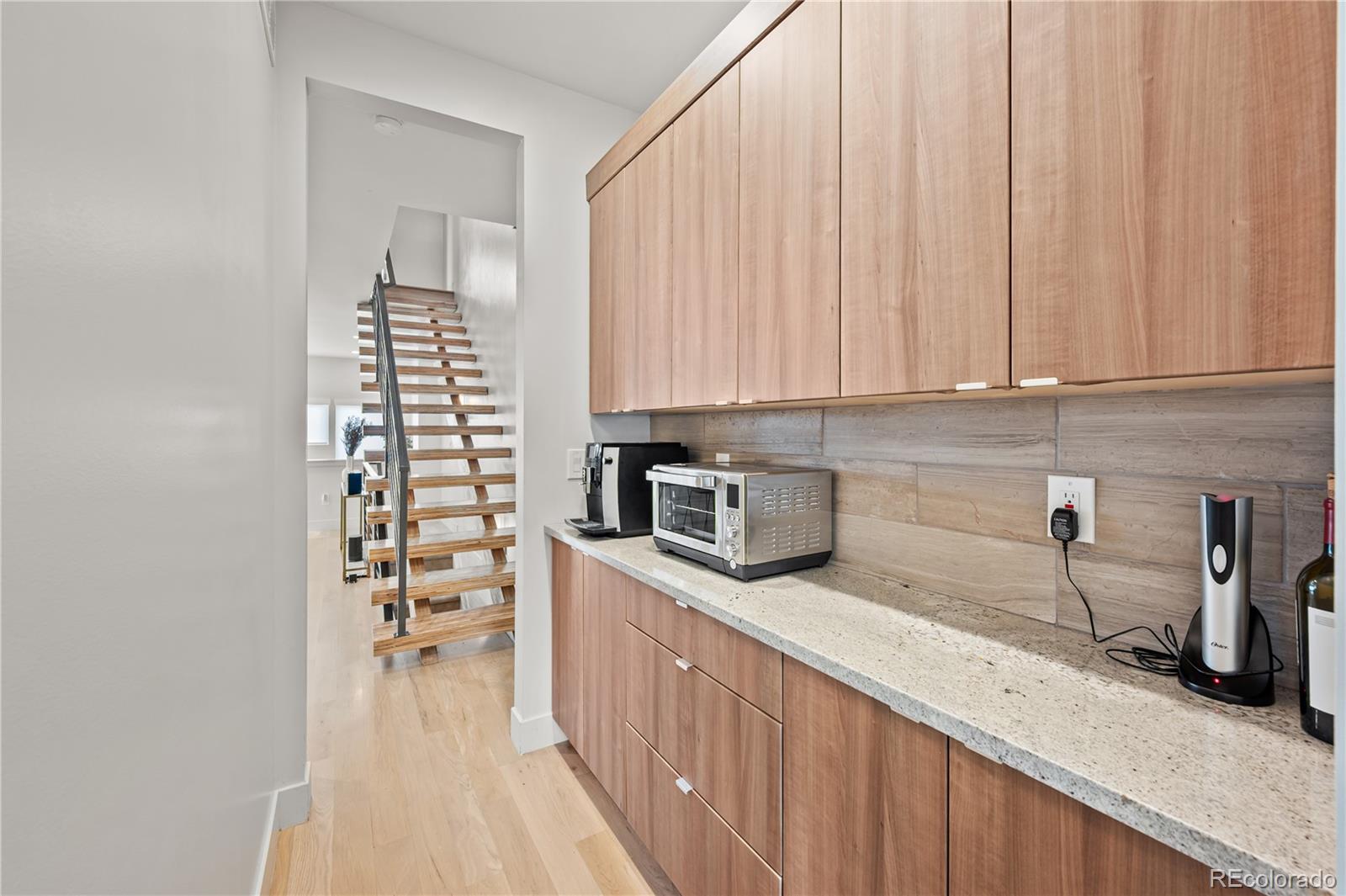 3448 West 36th Avenue Denver, CO 80211 - Photo 13 of 48 a kitchen with stainless steel appliances a sink a stove and cabinets