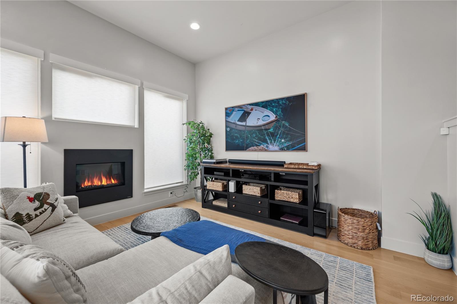 3448 West 36th Avenue Denver, CO 80211 - Photo 14 of 48 a living room with furniture and a fireplace