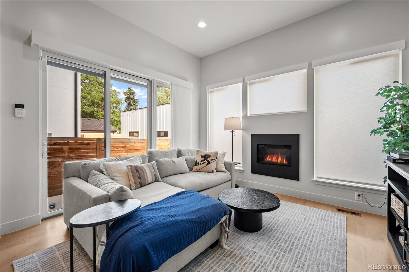 3448 West 36th Avenue Denver, CO 80211 - Photo 15 of 48 a living room with furniture and a fireplace