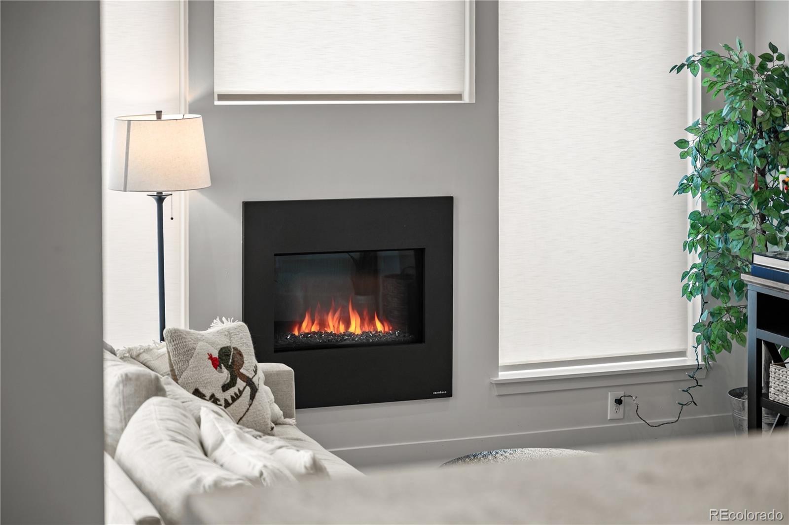 3448 West 36th Avenue Denver, CO 80211 - Photo 16 of 48 a living room with furniture and a fireplace