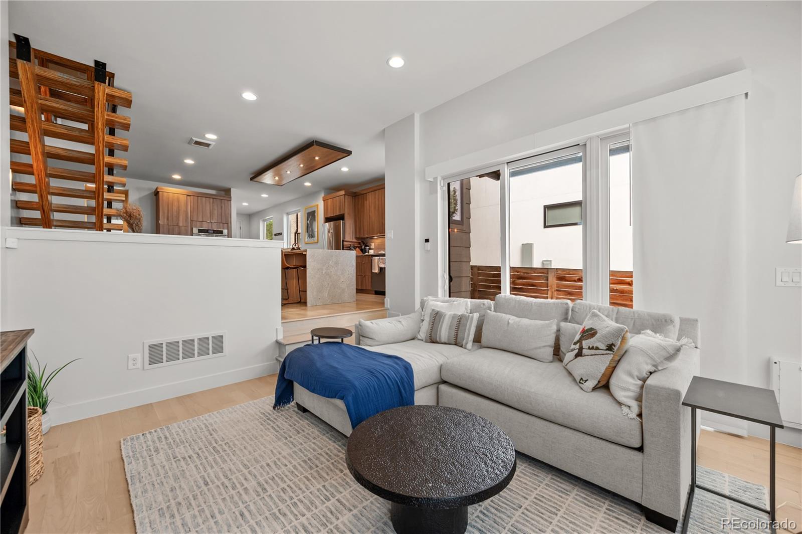 3448 West 36th Avenue Denver, CO 80211 - Photo 17 of 48 a living room with furniture and a large window