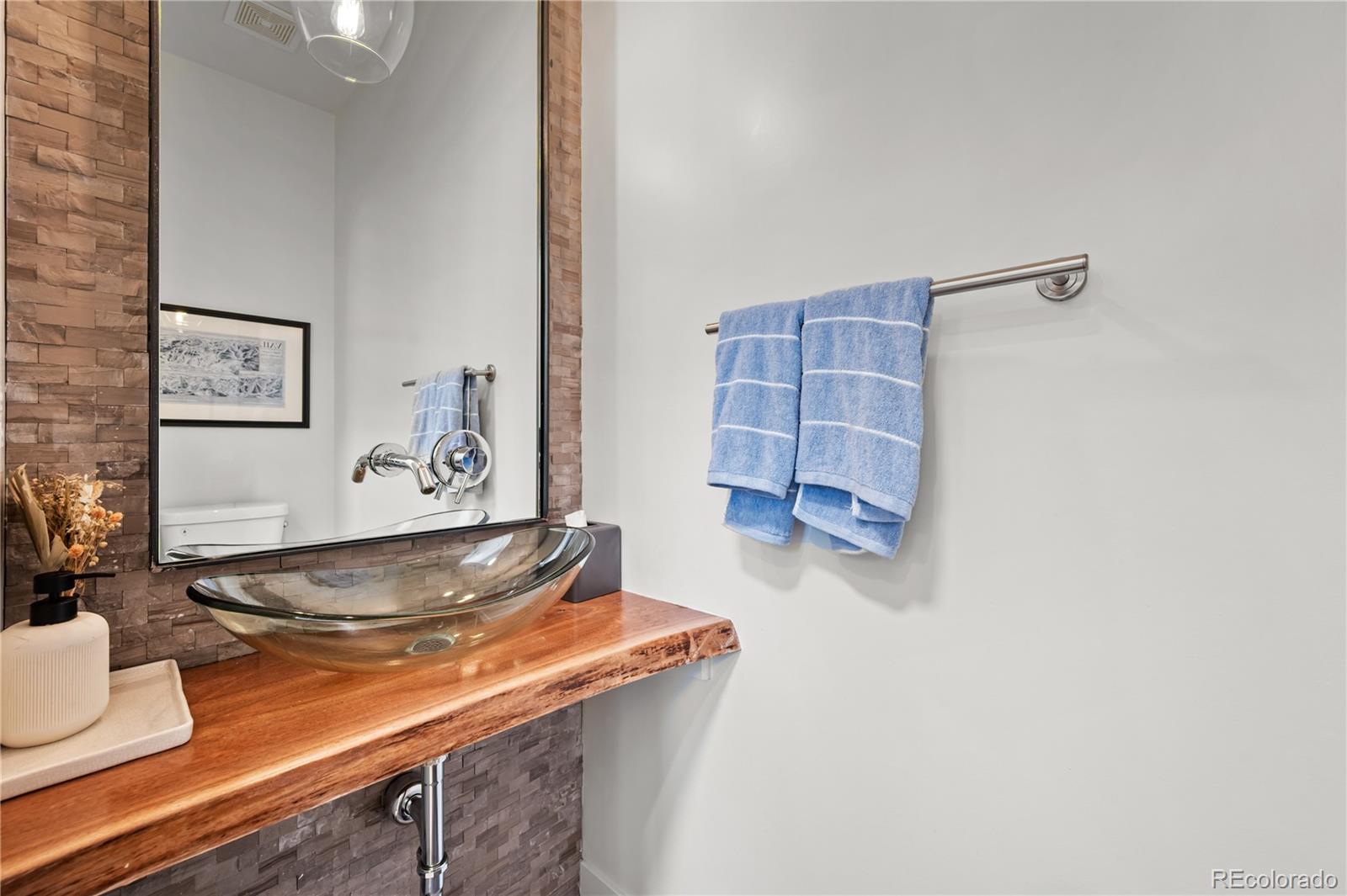 3448 West 36th Avenue Denver, CO 80211 - Photo 18 of 48 a kitchen with a wooden floor and cabinets