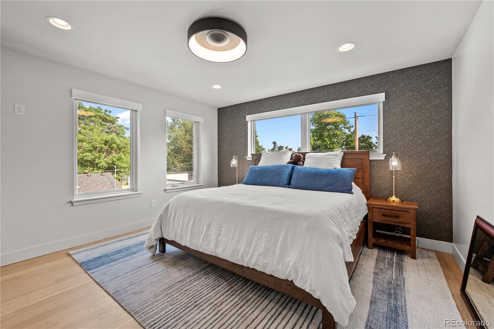 3448 West 36th Avenue Denver, CO 80211 - Photo 19 of 48 a bed sitting in a bedroom next to a window