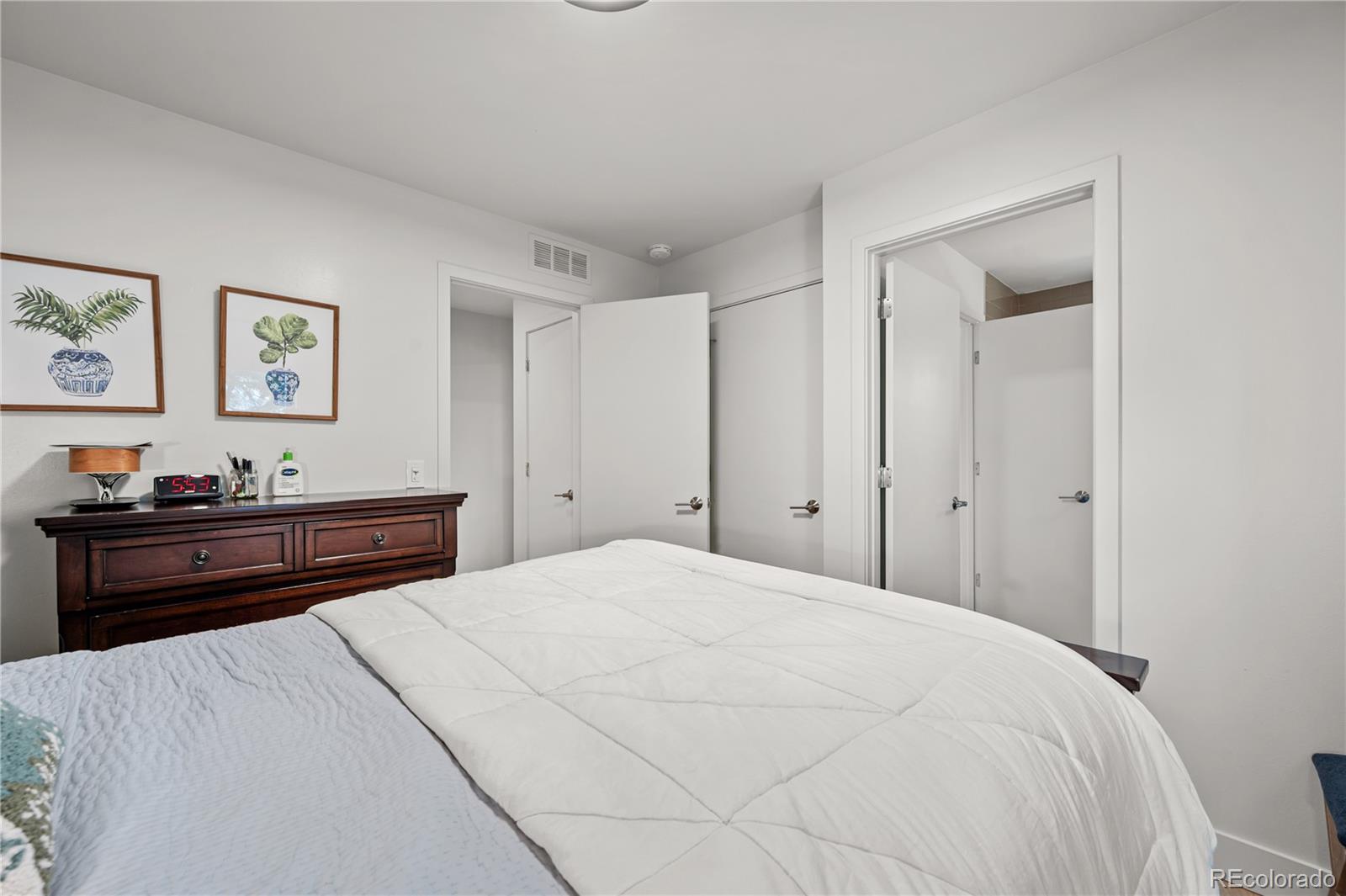 3448 West 36th Avenue Denver, CO 80211 - Photo 23 of 48 a bed room with a bed and wall painting