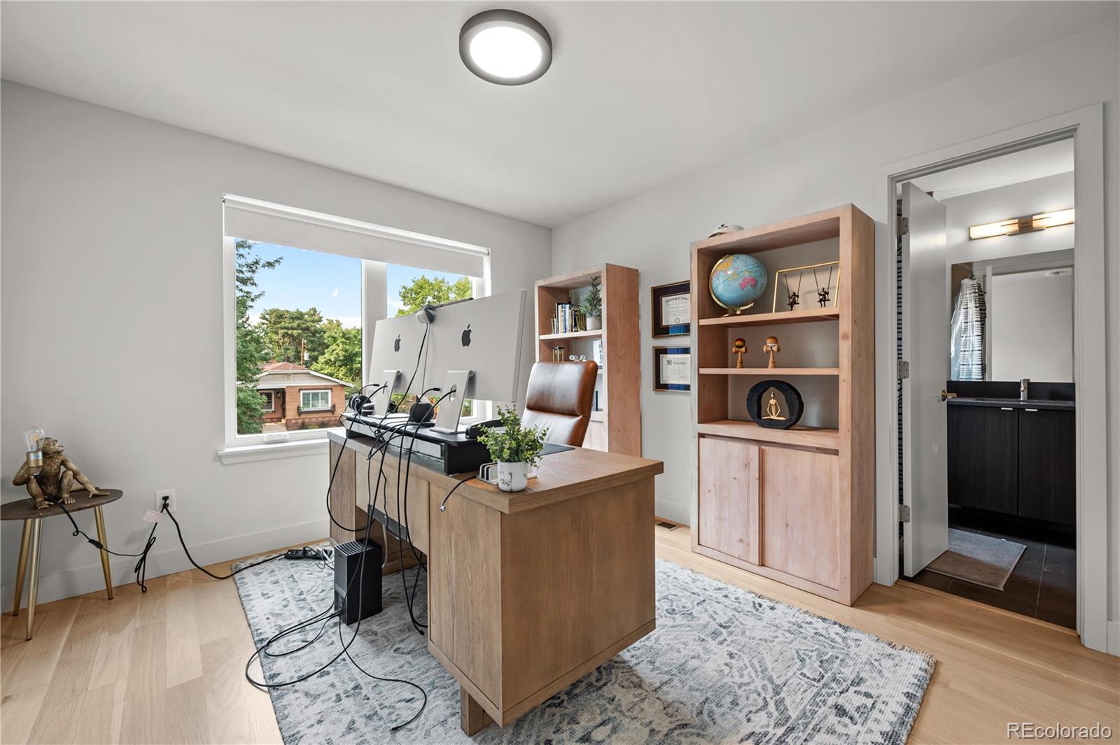 3448 West 36th Avenue Denver, CO 80211 - Photo 25 of 48 a living room with furniture and a window