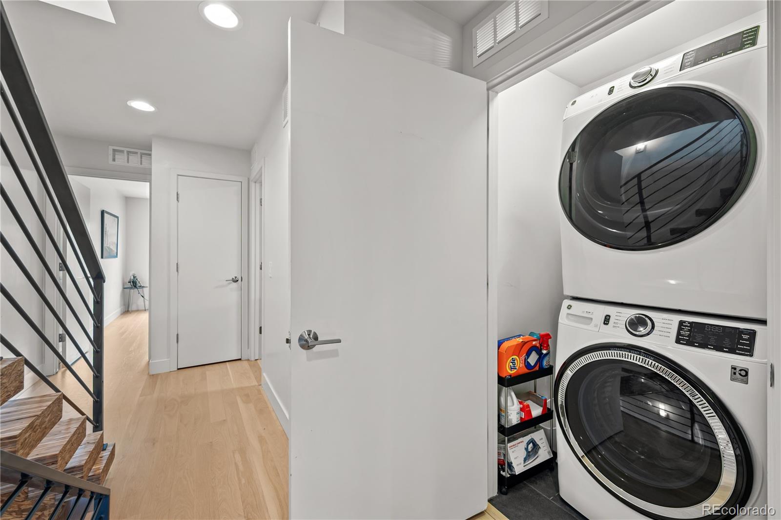 3448 West 36th Avenue Denver, CO 80211 - Photo 26 of 48 a view of storage and utility room with washer and dryer