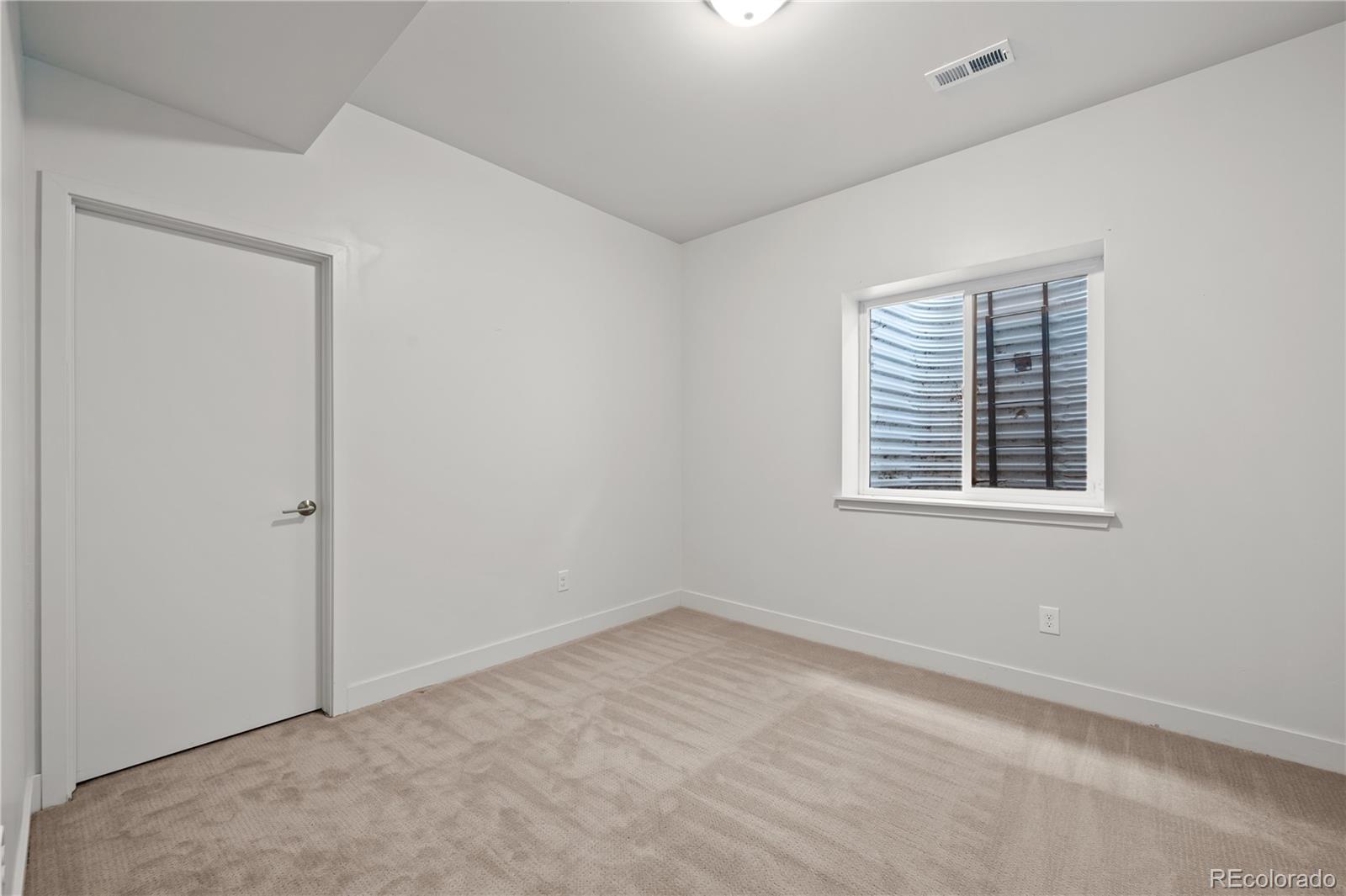 3448 West 36th Avenue Denver, CO 80211 - Photo 37 of 48 an empty room with a window