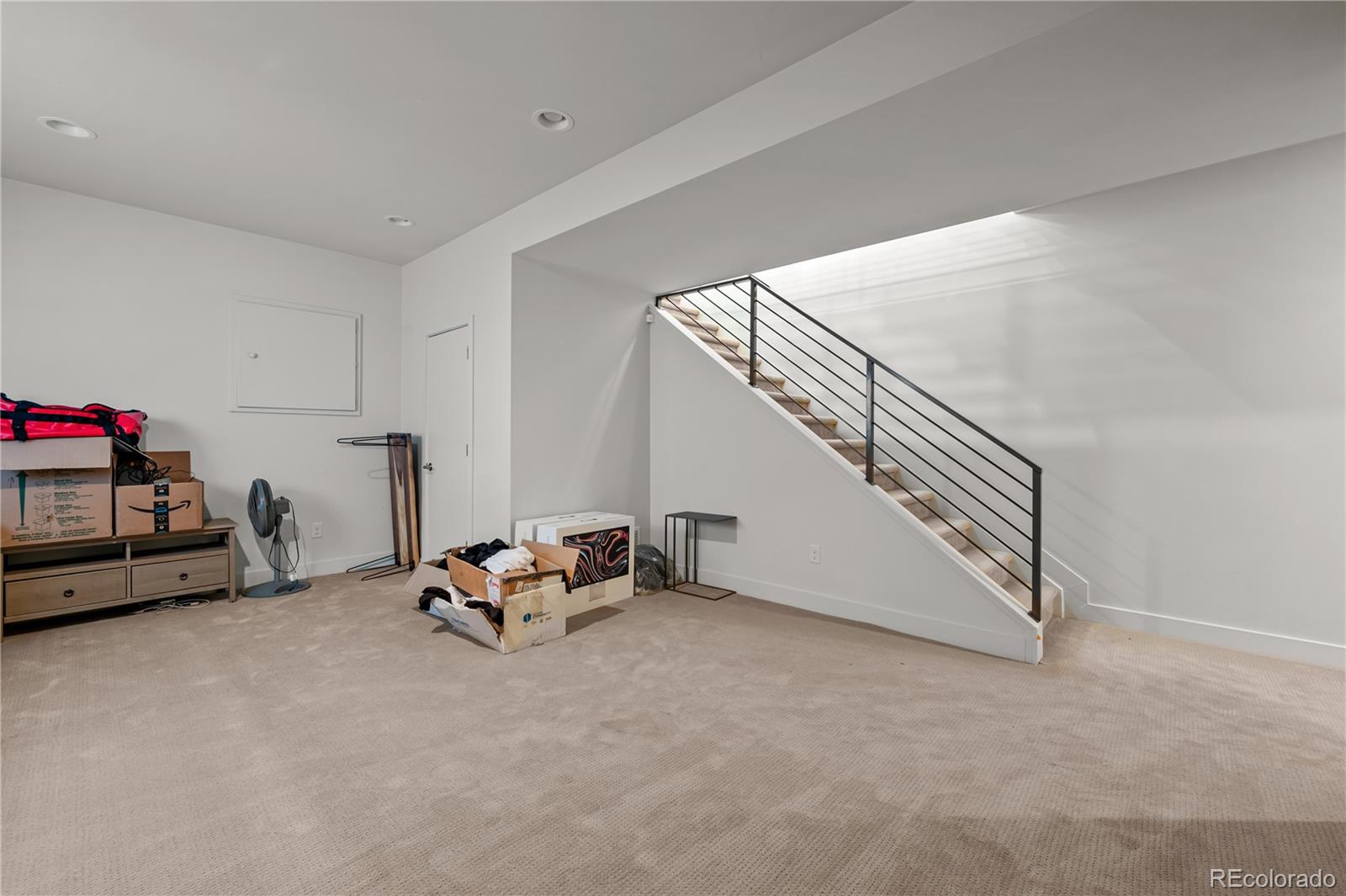 3448 West 36th Avenue Denver, CO 80211 - Photo 38 of 48 a living room with furniture and stairs