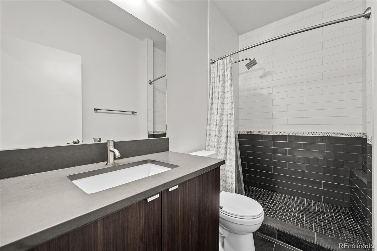 3448 West 36th Avenue Denver, CO 80211 - Photo 39 of 48 a bathroom with a sink toilet and shower