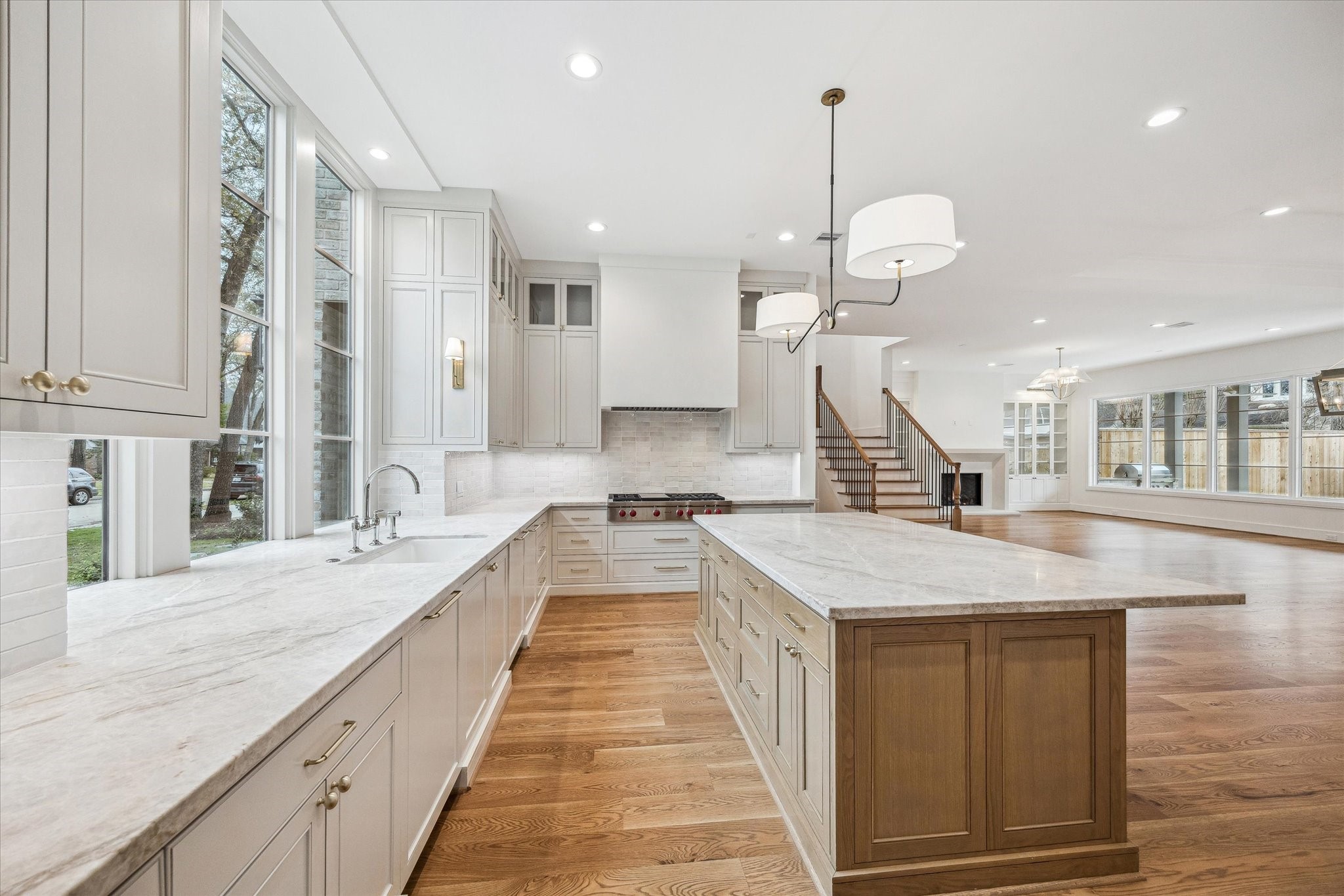 13023 Taylorcrest Road Houston, TX 77079 - Photo 10 of 49 a large kitchen with stainless steel appliances kitchen island granite countertop a sink and cabinets