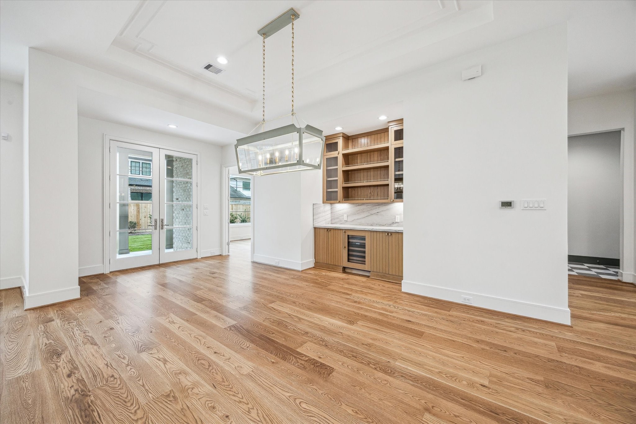 13023 Taylorcrest Road Houston, TX 77079 - Photo 12 of 49 a view of empty room with wooden floor and window