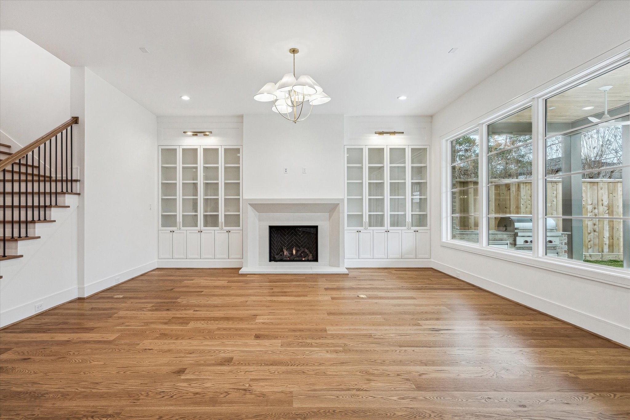 13023 Taylorcrest Road Houston, TX 77079 - Photo 13 of 49 a view of an empty room with wooden floor and a window