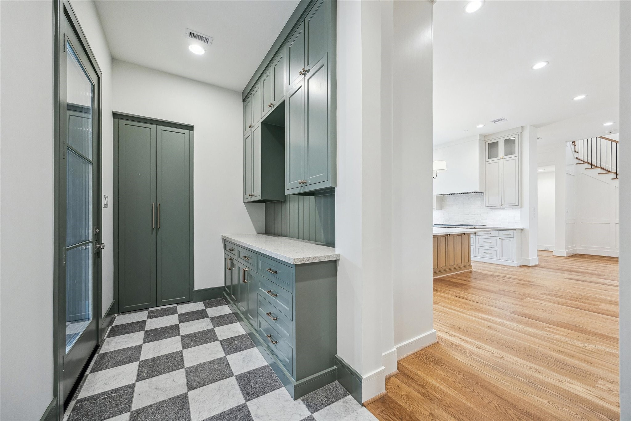 13023 Taylorcrest Road Houston, TX 77079 - Photo 18 of 49 Side entrance from Portico into a great drop off storage area! Includes stackable washer/dryer hook ups, designer tile flooring & custom paint!