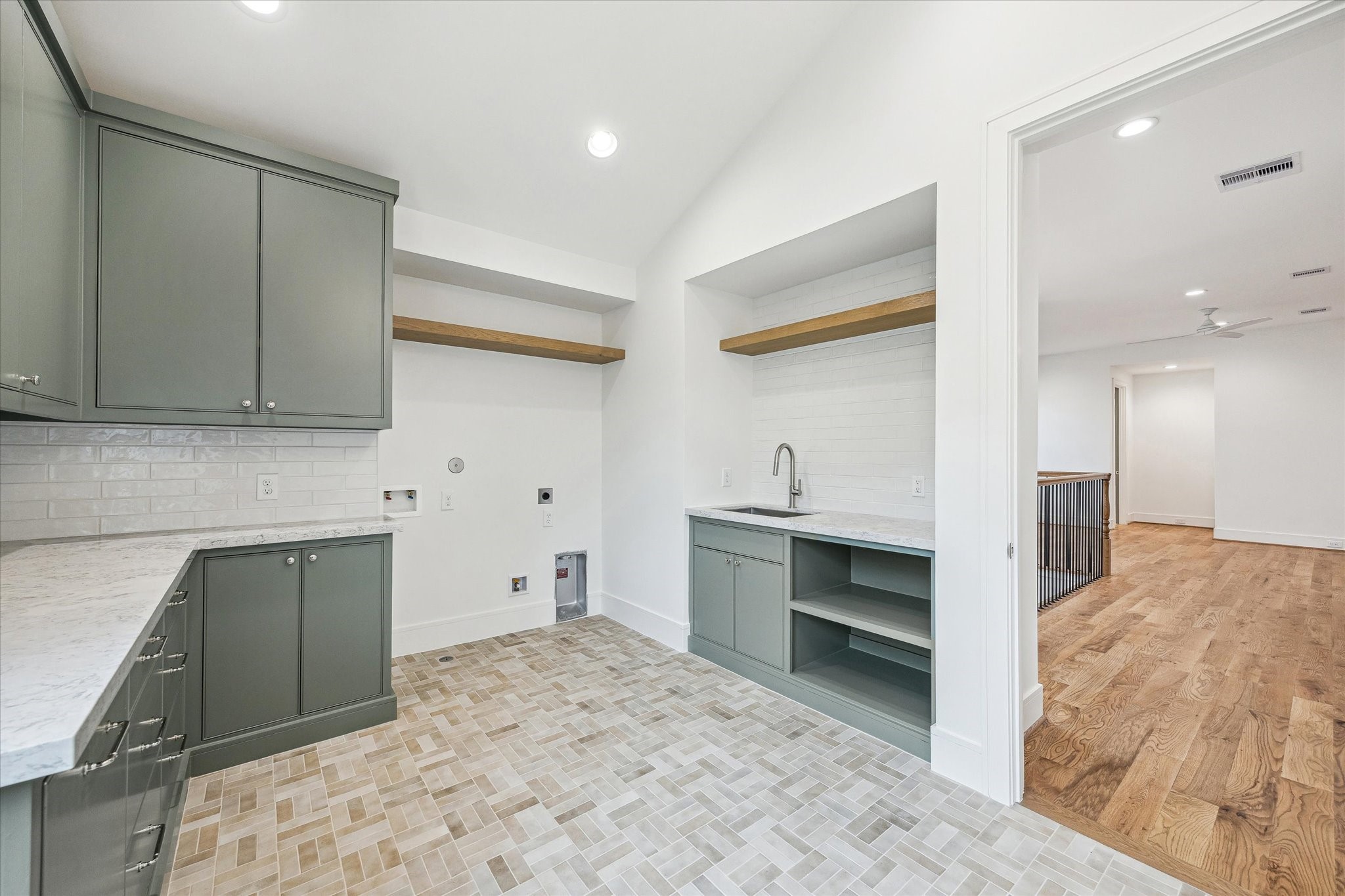 13023 Taylorcrest Road Houston, TX 77079 - Photo 27 of 49 Another view of upstairs utility with white oak floating shelves and abundance of storage and counters!