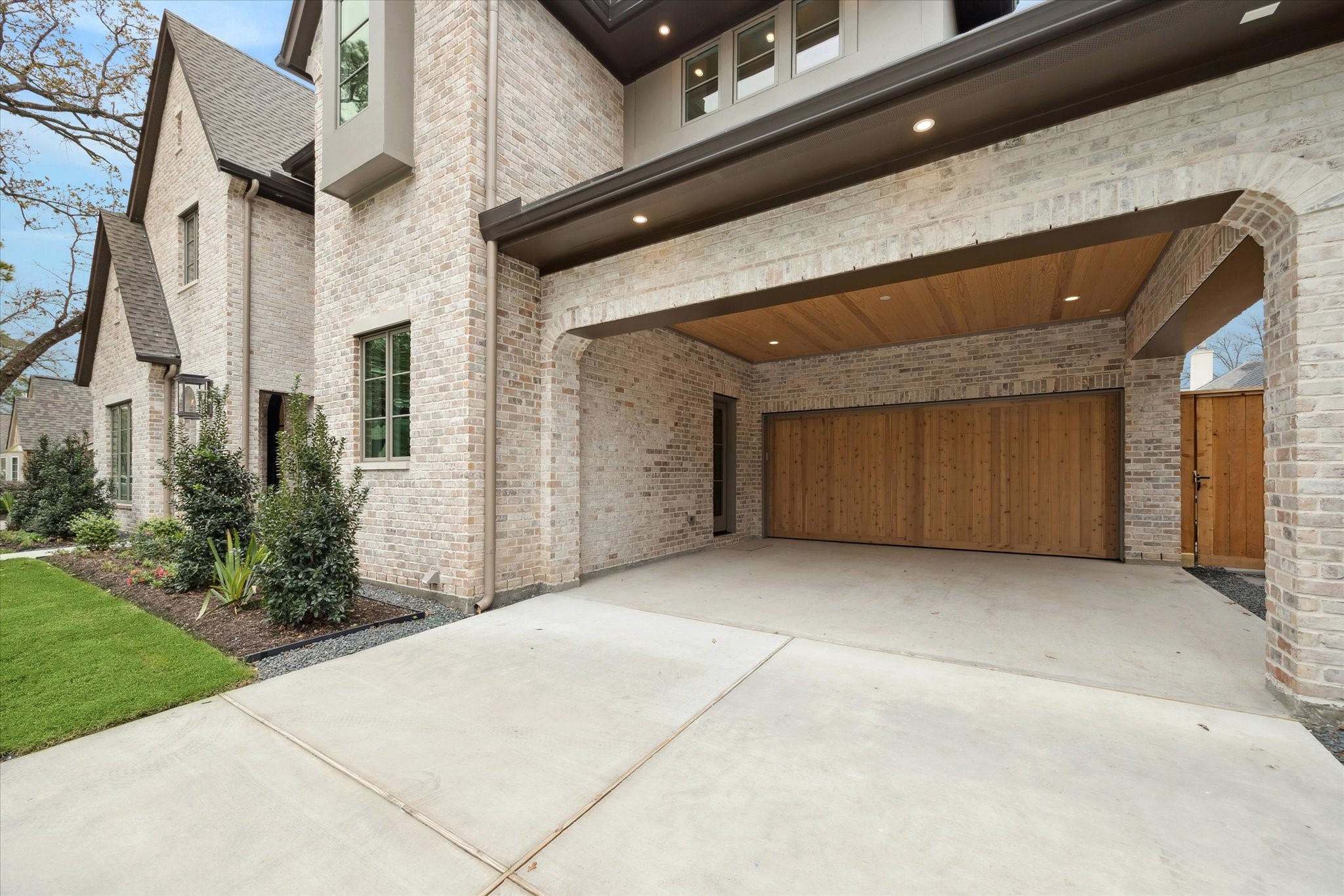 13023 Taylorcrest Road Houston, TX 77079 - Photo 3 of 49 Double driveway leads to full two car portico with wonderful side entrance into MUD room! Oversized custom garage door leads to oversized 2 car garage with EXTRA storage!