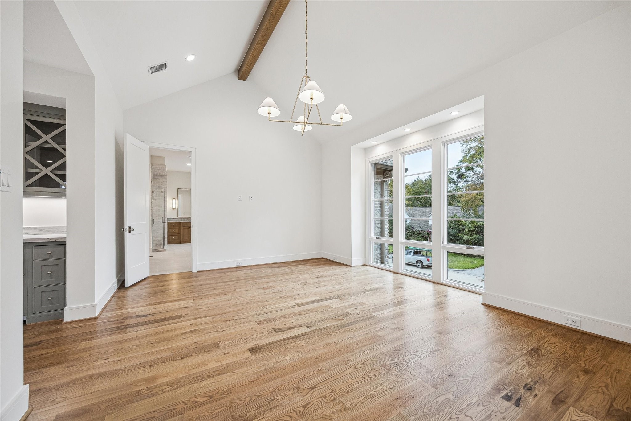 13023 Taylorcrest Road Houston, TX 77079 - Photo 32 of 49 a view of an empty room with wooden floor and a window