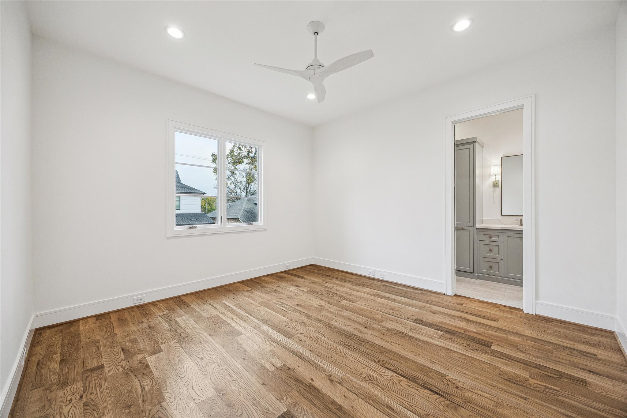 13023 Taylorcrest Road Houston, TX 77079 - Photo 39 of 49 wooden floor in an empty room with a window