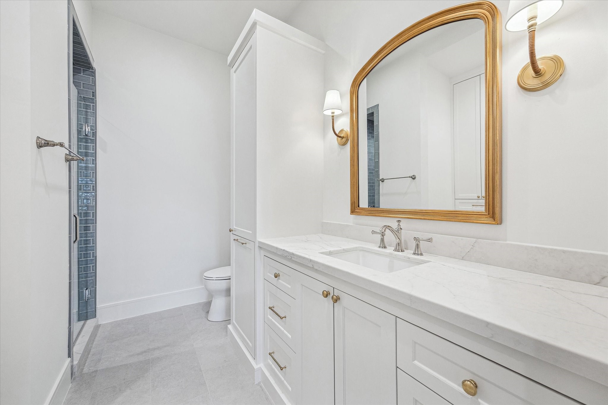 13023 Taylorcrest Road Houston, TX 77079 - Photo 42 of 49 a bathroom with a double vanity sink and mirror with toilet