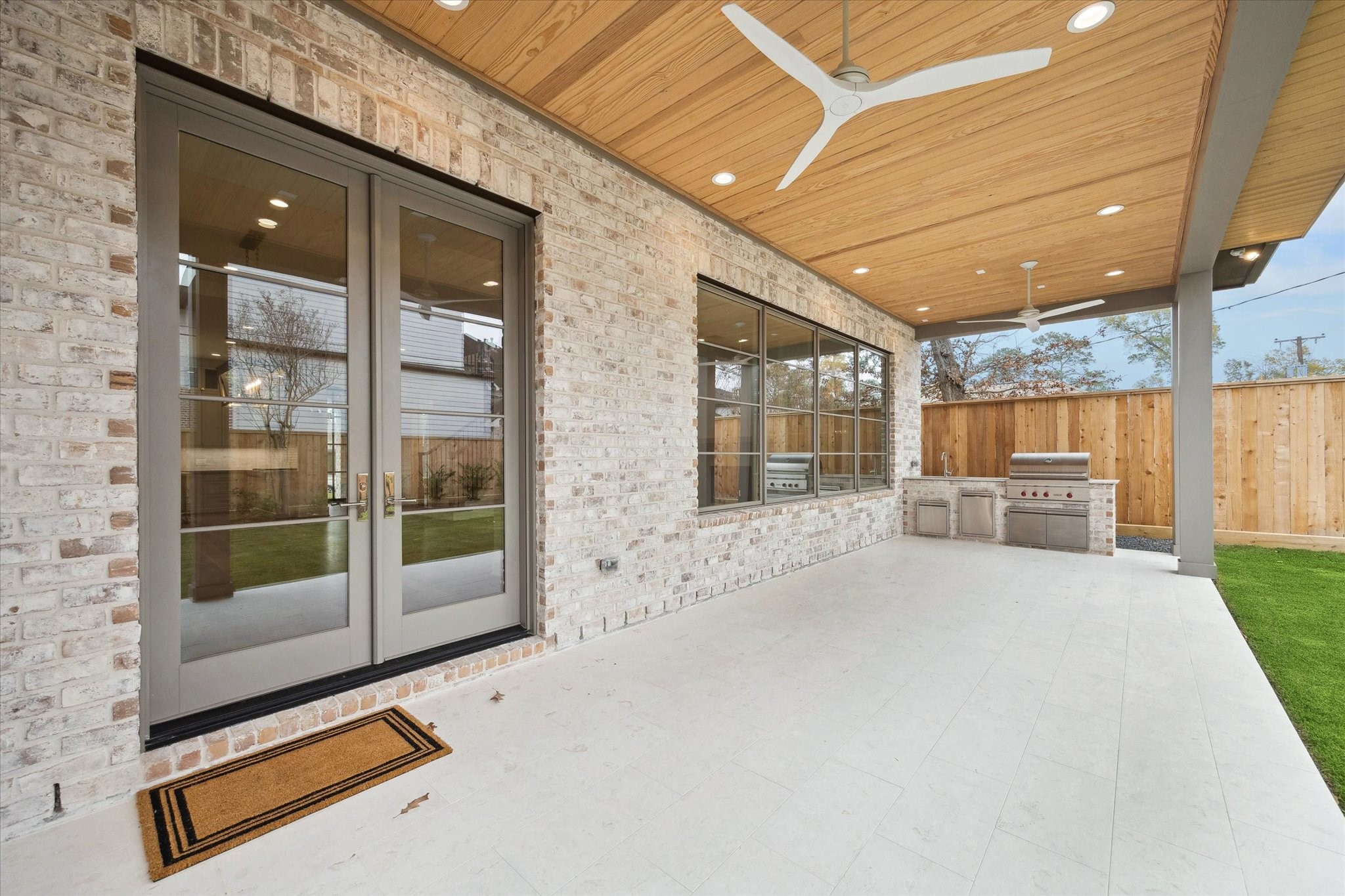 13023 Taylorcrest Road Houston, TX 77079 - Photo 45 of 49 Spacious covered Veranda overlooking Big backyard. Room for a future pool and grass space! Patio will accommodate seating and outdoor dining! Summer kitchen with work sink and Wolf Grill!