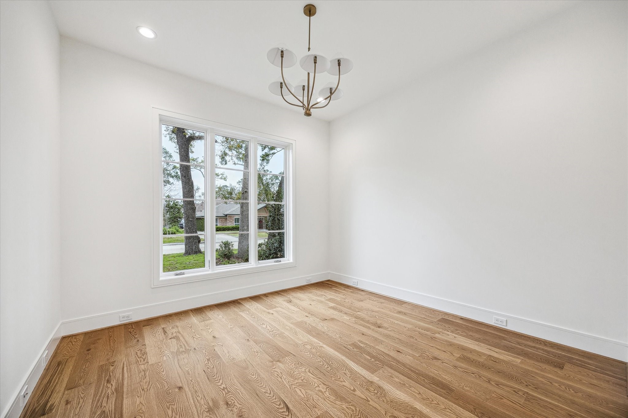 13023 Taylorcrest Road Houston, TX 77079 - Photo 6 of 49 a view of empty room with wooden floor and fan