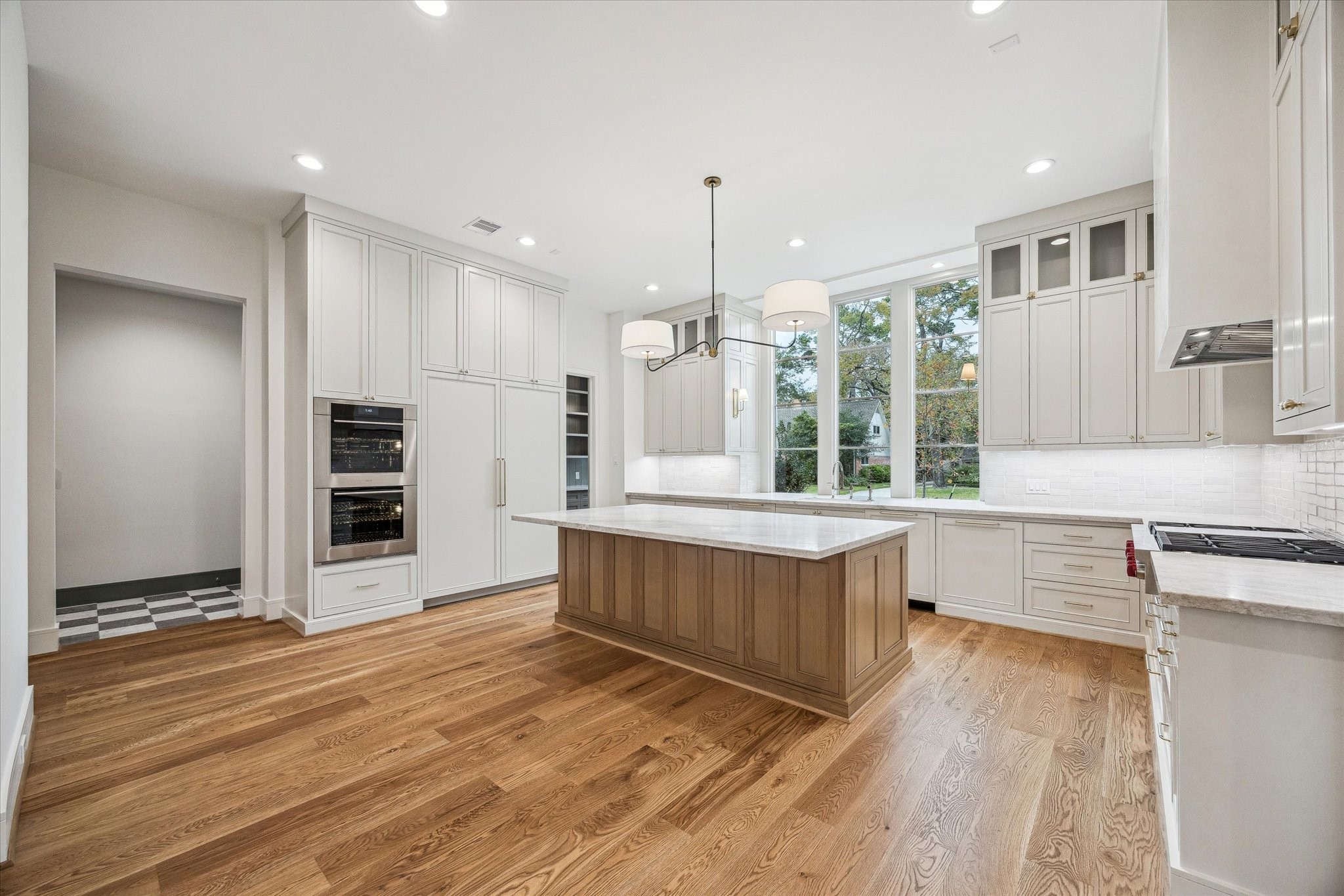 13023 Taylorcrest Road Houston, TX 77079 - Photo 7 of 49 a kitchen with stainless steel appliances granite countertop a stove a sink and a refrigerator